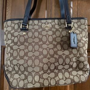 Coach Brown and Black Tote Handbag with Signature Pattern and Durable Material